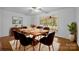 Dining room features a wood table, six chairs, and access to screened porch at 3338 Passmore Rd, Rock Hill, SC 29730