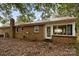 Rear view of brick house with sunroom and red metal roof at 3338 Passmore Rd, Rock Hill, SC 29730