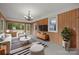 Bright living room showcasing natural light, neutral decor, and wood paneled walls at 3338 Passmore Rd, Rock Hill, SC 29730