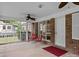 Relaxing screened porch with brick flooring and ceiling fan at 3338 Passmore Rd, Rock Hill, SC 29730