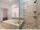 Bathroom boasts a large soaking tub and walk-in shower at 426 Saint Michaels Way, Fort Mill, SC 29708