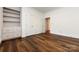 Bright bedroom with hardwood floors and built-in shelving at 426 Saint Michaels Way, Fort Mill, SC 29708