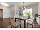 Formal dining room with hardwood floors, a chandelier, and large window at 426 Saint Michaels Way, Fort Mill, SC 29708