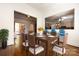 Bright dining room features hardwood floors, a wooden table with seating and a view of the kitchen at 426 Saint Michaels Way, Fort Mill, SC 29708