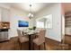 Bright dining room with hardwood floors and a view into the kitchen at 426 Saint Michaels Way, Fort Mill, SC 29708