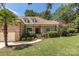 Brick home with a palm tree, manicured lawn, and welcoming front steps at 426 Saint Michaels Way, Fort Mill, SC 29708