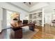 Bright home office with built-in shelving and hardwood floors at 426 Saint Michaels Way, Fort Mill, SC 29708