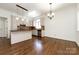 Kitchen with island, hardwood floors, and updated cabinetry at 426 Saint Michaels Way, Fort Mill, SC 29708