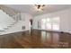 Bright living room featuring hardwood floors and large windows at 426 Saint Michaels Way, Fort Mill, SC 29708