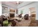 Spacious living room featuring a fireplace and built-in shelving at 426 Saint Michaels Way, Fort Mill, SC 29708