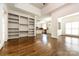 Open living room with hardwood floors and built-in shelving at 426 Saint Michaels Way, Fort Mill, SC 29708