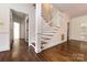 Elegant staircase with hardwood floors and white railings at 426 Saint Michaels Way, Fort Mill, SC 29708