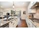 Modern kitchen with granite countertops and white cabinets at 7037 Hyde Park Dr, Indian Trail, NC 28079