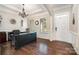 Elegant home office with rich hardwood floors, plantation shutters, and a modern desk for a professional workspace at 7037 Hyde Park Dr, Indian Trail, NC 28079