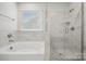 Bathroom with soaking tub and separate glass shower at 8336 Acadia Pkwy, Sherrills Ford, NC 28673