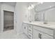 Double vanity bathroom with marble-look flooring and walk-in shower at 8336 Acadia Pkwy, Sherrills Ford, NC 28673