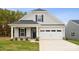 Two-story house with gray siding, white trim, and a two-car garage at 8336 Acadia Pkwy, Sherrills Ford, NC 28673