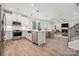 Open concept kitchen with island, stainless steel appliances, and view of living area at 8336 Acadia Pkwy, Sherrills Ford, NC 28673