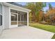 Screened porch and patio area, overlooking a wooded backyard at 8336 Acadia Pkwy, Sherrills Ford, NC 28673