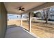 Covered back porch with ceiling fan at 528 Moss Springs Rd, Albemarle, NC 28001