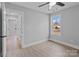 Well-lit bedroom with hardwood floors and access to hallway at 528 Moss Springs Rd, Albemarle, NC 28001