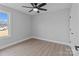 Bright bedroom featuring hardwood floors and a large window at 528 Moss Springs Rd, Albemarle, NC 28001