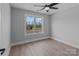 Simple bedroom with ceiling fan and large window at 528 Moss Springs Rd, Albemarle, NC 28001