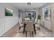 Bright dining room with glass table and beige chairs at 528 Moss Springs Rd, Albemarle, NC 28001