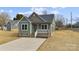 Charming craftsman style home with a welcoming front porch and landscaped yard at 528 Moss Springs Rd, Albemarle, NC 28001