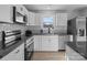 Modern kitchen with stainless steel appliances and granite countertops at 528 Moss Springs Rd, Albemarle, NC 28001