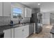 Sleek kitchen featuring white cabinets and granite countertops at 528 Moss Springs Rd, Albemarle, NC 28001