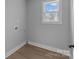 Laundry room with vinyl flooring and built-in shelving at 528 Moss Springs Rd, Albemarle, NC 28001