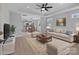 Virtually staged living room featuring comfortable furniture and open floor plan at 528 Moss Springs Rd, Albemarle, NC 28001