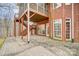 Brick house with a deck, patio, stairs and landscaping at 2804 Providence View Ln, Charlotte, NC 28270