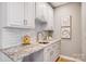 Kitchenette with white cabinets and granite countertops at 2804 Providence View Ln, Charlotte, NC 28270