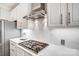 Close-up of kitchen gas cooktop and white marble countertops at 2804 Providence View Ln, Charlotte, NC 28270