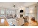 Spacious living room with hardwood floors, fireplace, and access to a deck at 2804 Providence View Ln, Charlotte, NC 28270