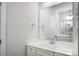 Bright bathroom with white vanity and large mirror at 5308 Verona Rd # 75, Charlotte, NC 28213