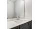 Bathroom with gray vanity, white countertop, and rectangular mirror at 5308 Verona Rd # 75, Charlotte, NC 28213