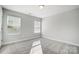 Spacious bedroom with neutral walls and carpet at 5308 Verona Rd # 75, Charlotte, NC 28213