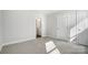 Well-lit bedroom with carpet and access to en-suite bathroom at 5308 Verona Rd # 75, Charlotte, NC 28213