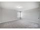 Simple bedroom with carpet and large window at 5308 Verona Rd # 75, Charlotte, NC 28213