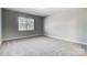 Bright bedroom with neutral walls and carpeting at 5308 Verona Rd # 75, Charlotte, NC 28213
