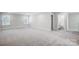 Large bedroom with plush carpet and an attached bath at 5308 Verona Rd # 75, Charlotte, NC 28213