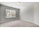 Bright bedroom featuring neutral walls and carpet at 5308 Verona Rd # 75, Charlotte, NC 28213