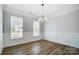 Formal dining room with hardwood floors and elegant chandelier at 5308 Verona Rd # 75, Charlotte, NC 28213
