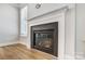Modern gas fireplace with a gray stone surround at 5308 Verona Rd # 75, Charlotte, NC 28213