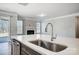 Kitchen island with sink, faucet, and stainless steel dishwasher at 5308 Verona Rd # 75, Charlotte, NC 28213