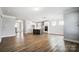 Modern kitchen with white cabinets, gray island and stainless steel appliances at 5308 Verona Rd # 75, Charlotte, NC 28213