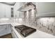 Gas cooktop with white shaker cabinets and hexagon backsplash at 5308 Verona Rd # 75, Charlotte, NC 28213